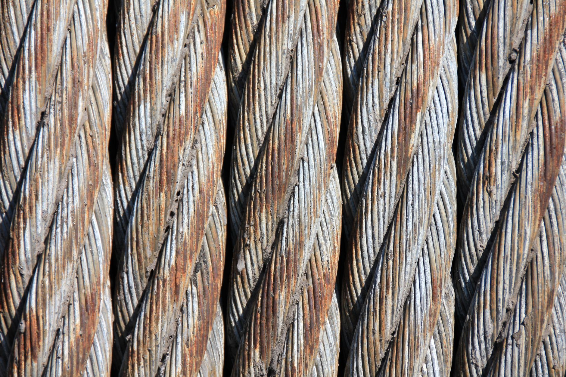 Close-up of rusty steel cables showcasing intricate texture and patterns.